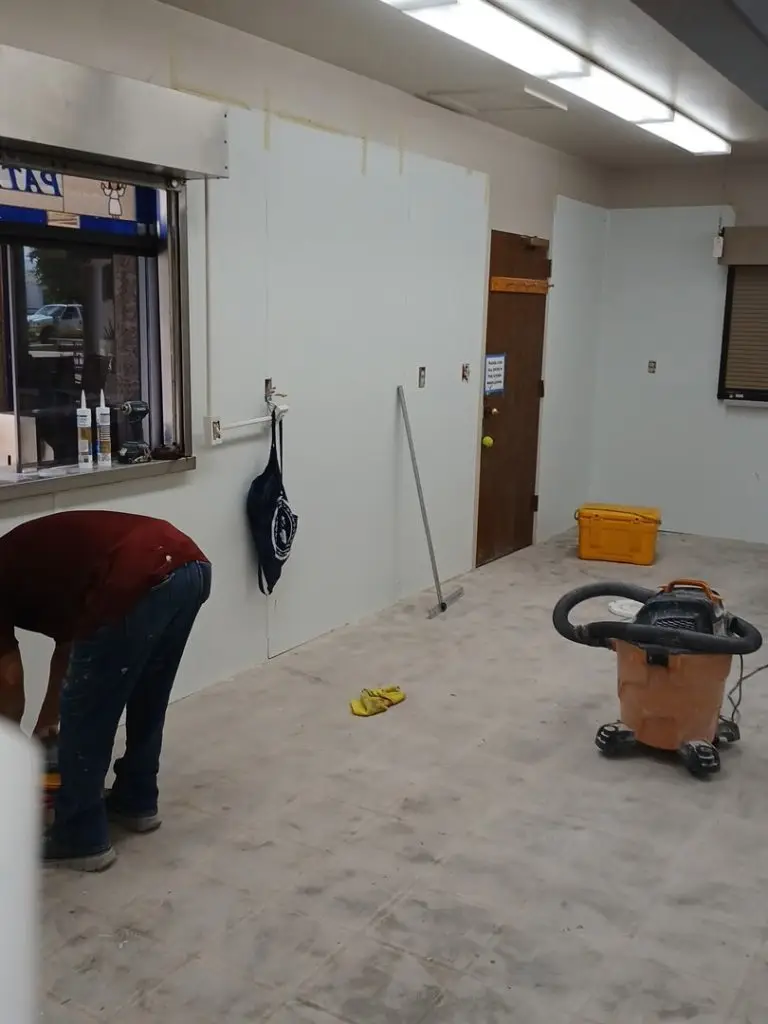 Carriage Manor Resort Prepping Kitchen Floor after adding wall board before new cabinets are installed.